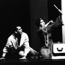 Photograph of Déxter Cápiro (Orestes Garrigó) and Amarilys Núñez (Clitemnestra) in the production, "Electra Garrigó"