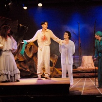 Photograph of Déxter Cápiro (Lorca ensangrentado), Tomás Doval (Lorca en el traje blanco), Ariel Texidó (Lorca en verde) and Paulina Gálvez (Lorca como mujer) in the production, "Lorca con un vestido verde"